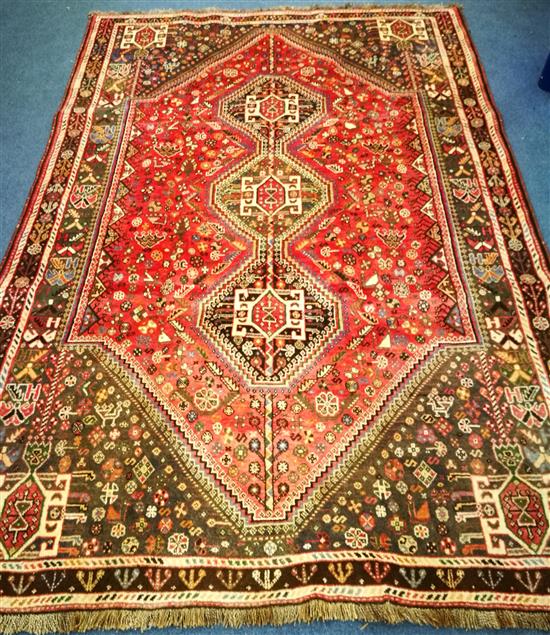 A Qashqai red ground carpet 265 x 175cm